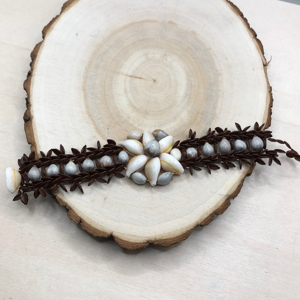 Handcrafted artisan sea shell and seed/nut bead boho bracelet.